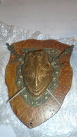 Old knight's metal shield with figured swords