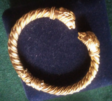 A special gold bracelet with a dragon's head, cuffs.