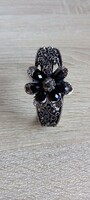 Metal bracelet with black stones and flowers