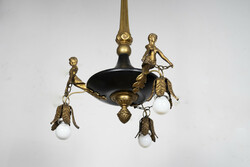Empire style chandelier decorated with gilded female torsos
