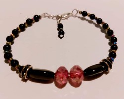 Women's bracelet made of black and translucent red beads