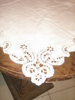 Beautiful elegant light tablecloth with white lacy edges