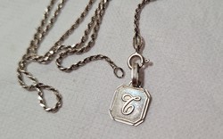 Twisted silver necklace with monogram pendant