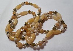 Vintage, long string of pearls with a mineral effect