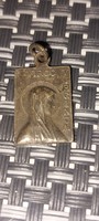 A religious pendant from a legacy