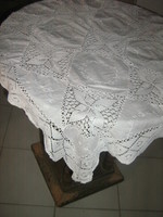 White embroidered tablecloth with a beautiful hand-crocheted edge and insert