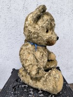 Antique teddy bear stuffed with straw
