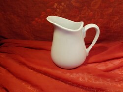 Snow-white porcelain jug, spout.
