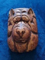 Animal head carved from wood, carving that can be hung on the wall, decorative object