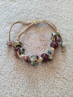 A bracelet strung with many ceramic beads