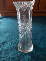 Antique cast-polished glass vase with a strand of flowers