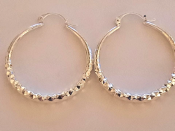 Large, silver-plated hoop earrings
