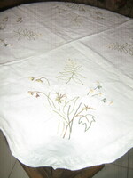 Beautiful hand-embroidered tablecloth with spring wildflowers