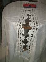 A pair of beautiful vintage-style crocheted stained-glass curtains with lace edges