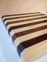 Handmade thick cutting board made of hard wood with stripes
