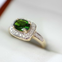 Gold ring with diamonds and tourmaline stones