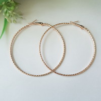 New, gold-colored, twisted chain motif hoop earrings