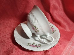 Antique porcelain coffee cup with saucer