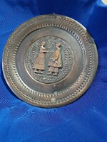 Red copper phalídis plate with folk, female and male depictions.