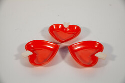 3 heart-shaped porcelain bowls.