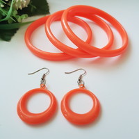 New, orange plastic jewelry set - bangle, bracelet + earrings