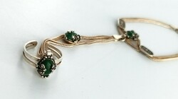 Silver bracelet with ring and green stones