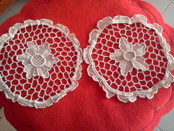 A pair of lace tablecloths