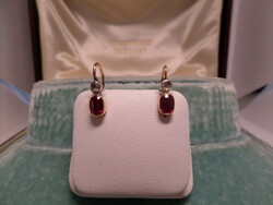 A pair of antique gold earrings with synthetic rubies and diamonds