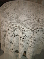 Beautiful antique ecru hand-crocheted round tablecloth with Art Nouveau features