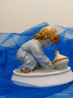 Zsolnay porcelain figure, a little boy playing with a baby