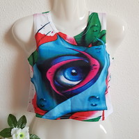 New, approx. Xs pink crop top with blue eye pattern, sleeveless belly t-shirt