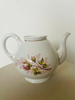Vintage white teapot with a rose bud pattern, gilded edge, bay