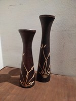 A pair of Scandinavian-style solid wood candle holders