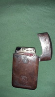 Old red stone inlaid metal casing storm lighter lighter as shown in the pictures