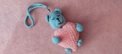 Crocheted teddy bear with hearts