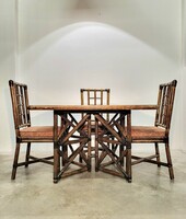 Vintage Italian mid century modern rattan dining table with four chairs