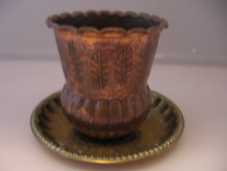 A copper cup and vase on a small hammered copper tray