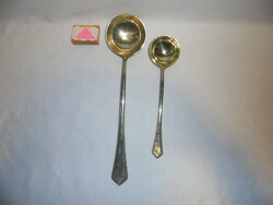 Two ladles - larger and smaller - together