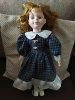 Doll with porcelain limbs