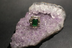 Small silver ring with brilliant green stones