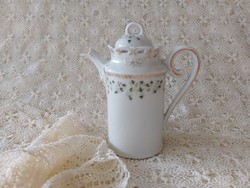 Old porcelain small jug with leaf pattern spout