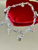 Shiny silver bracelet with pendants