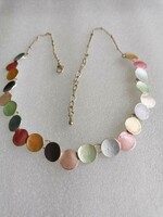 New! Silver braided necklace. Many colored discs with pendants