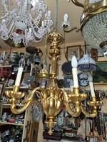 Old restored gilded wooden chandelier