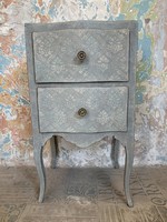 Pale turquoise nightstand with textured painting, ocher plush drawer cover