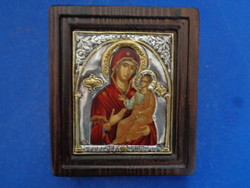 This is a choice copy of a Byzantine icon, painted on wood and covered with 950 sterling silver