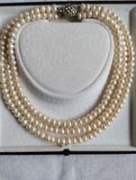 Three rows of cultured pearl necklaces