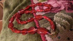 54 Cm necklace made of red glass beads.