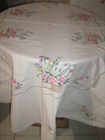 Beautiful floral oval tablecloth with a lace edge embroidered with small cross stitches
