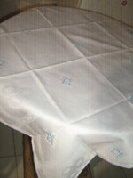 Elegant damask tablecloth embroidered with beautiful snow-white blue crosses